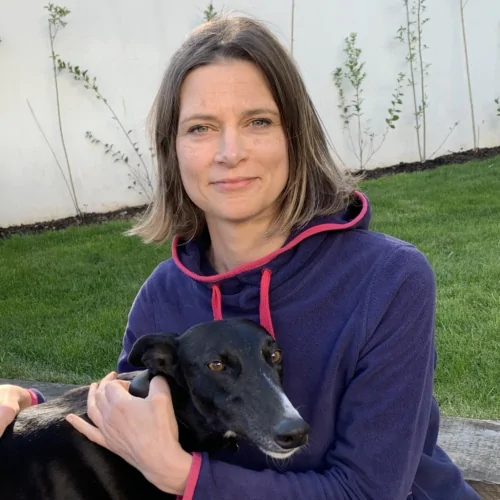 A picture of FirstVet's Dr Rachel Cox holding her dog