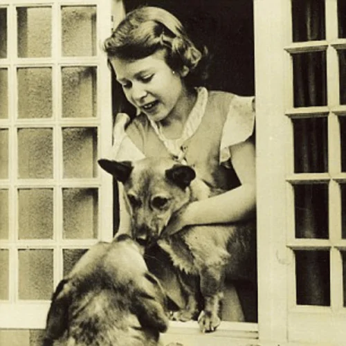 A picture of young Queen Elizabeth II with her Corgi