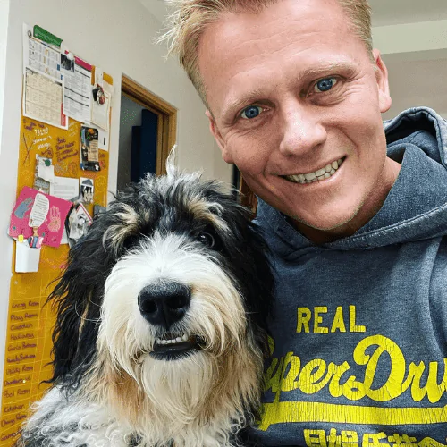 A picture of Dr Scott Miller and his therapy dog Ludo