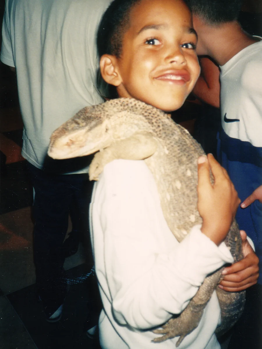 Fabian Rivers as a child, sporting a cool reptile